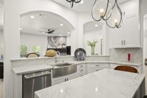 Kitchen and beside living room by tayton remodeling