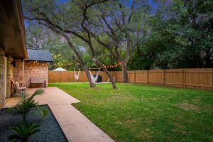 Outdoor with green grass and tress that has series lights