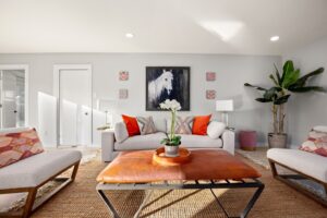 Living room with painting in the board of horse