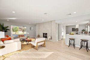 Living room that has outdoor view and kitchen beside view