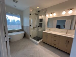 Bathroom with bathtub shower and a big mirror with outdoor view beside the bathtub